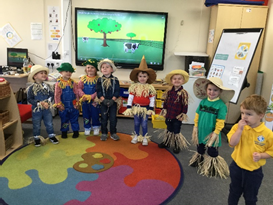 A group of children dressed up as scarecrows